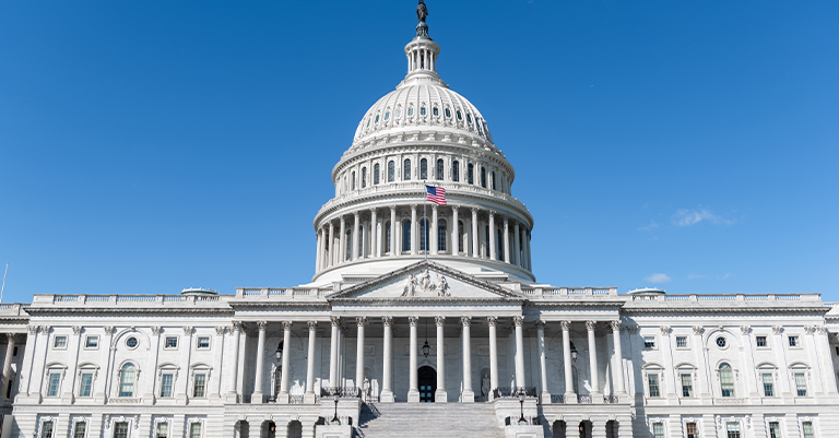 The U.S. Capitol building under a clear blue sky, symbolizing structure, authority, and clarity in communication.